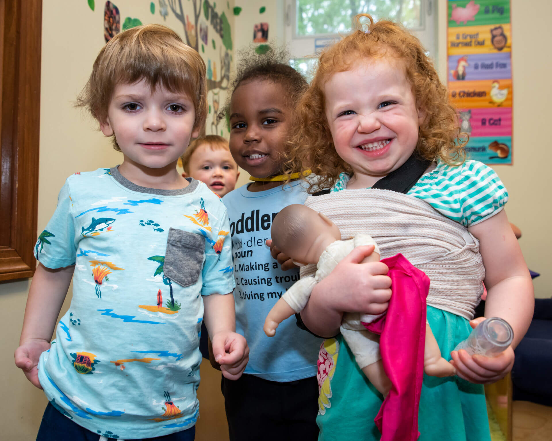 Toddlers Playing with a Baby Toy