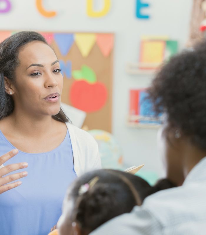 preschooler teacher talking to parents