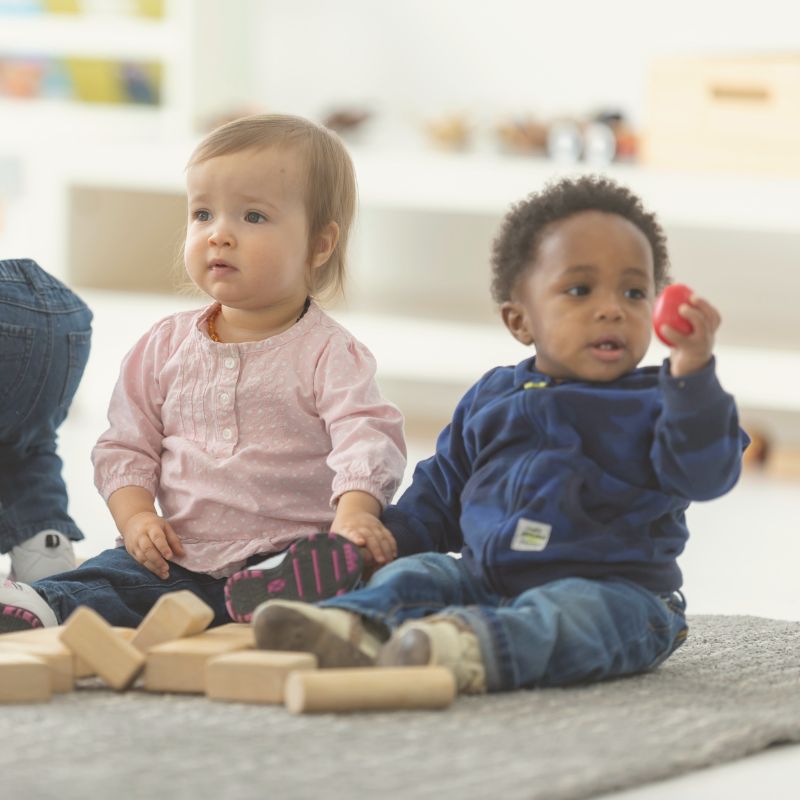 babies playing together