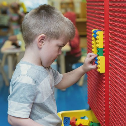 preschool boy playing with legos