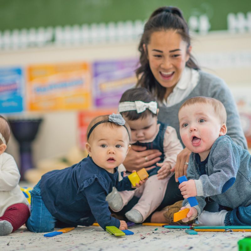 teacher reading to infants