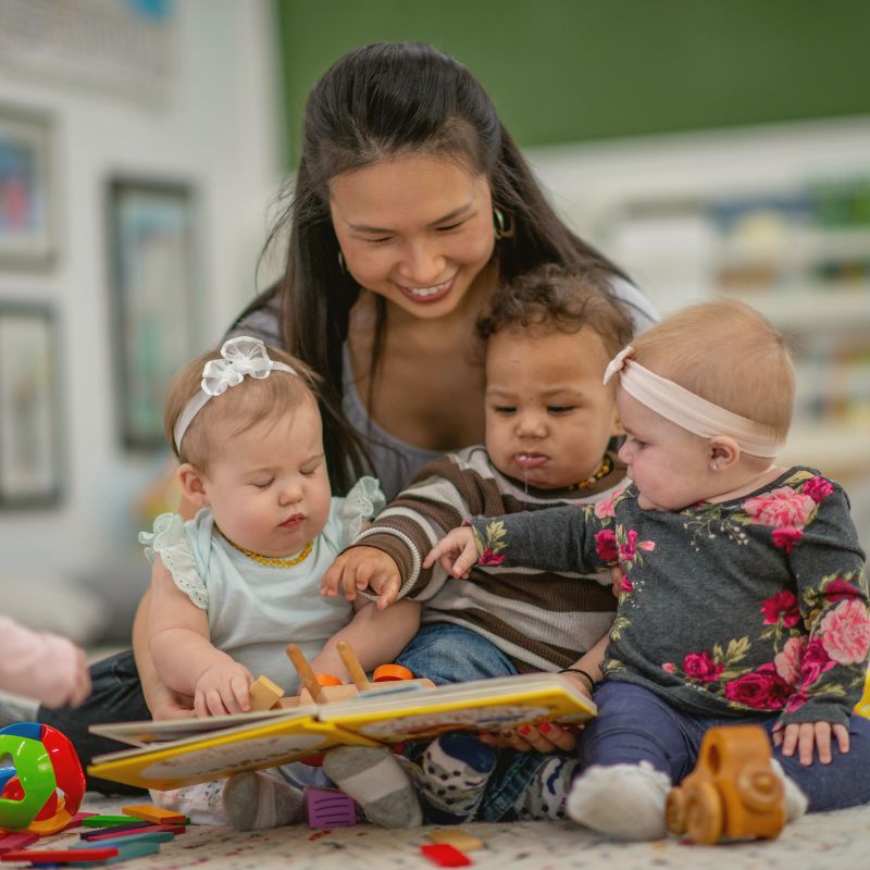 teacher reading to babies