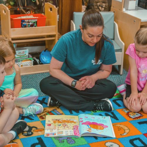 preschool teacher reading to the kids at ChildScape