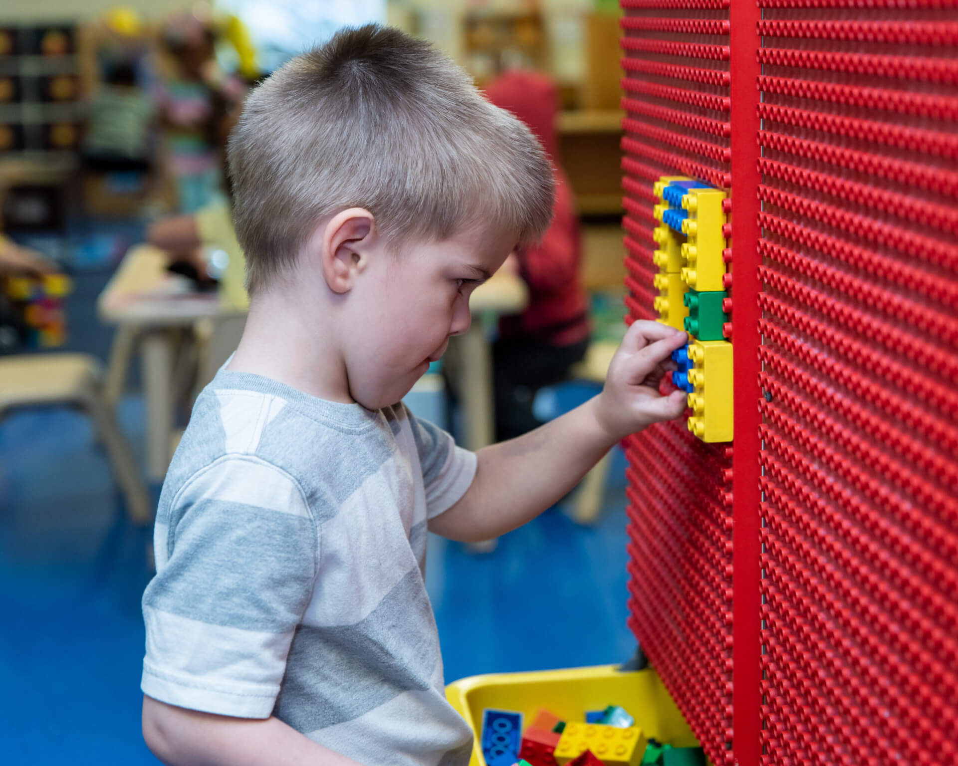toddler-boy-plyaing-legos