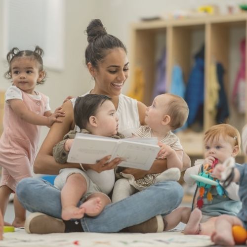 teacher reading to toddlers